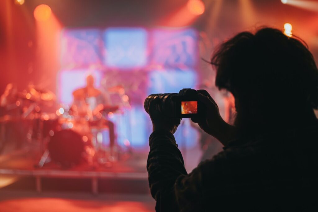 Person with a camera at a concert