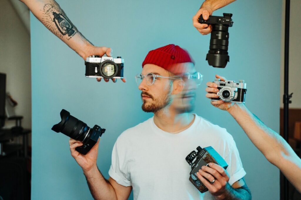 Man with several cameras