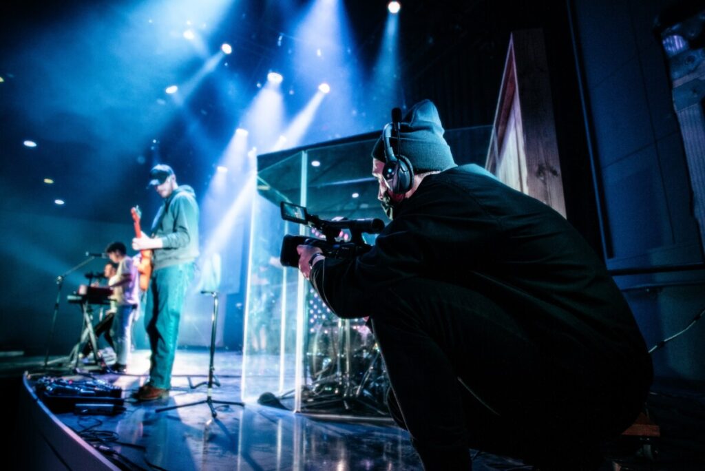 Man with a camera at a concert