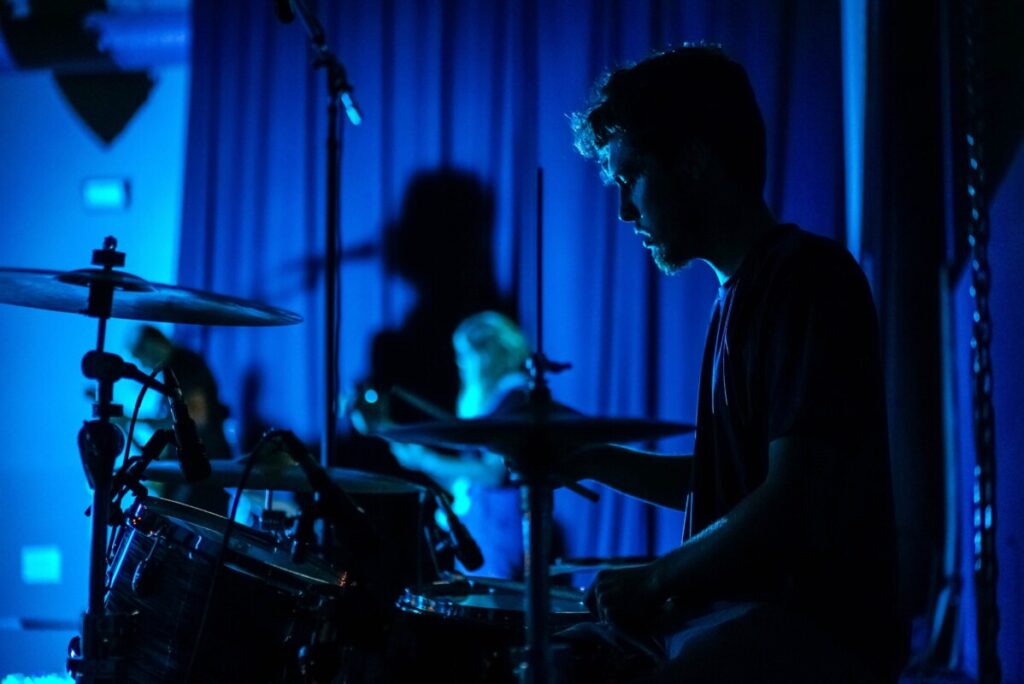 Man playing drums at concert