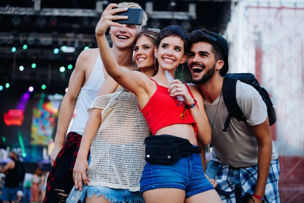 Group taking a selfie at a concert