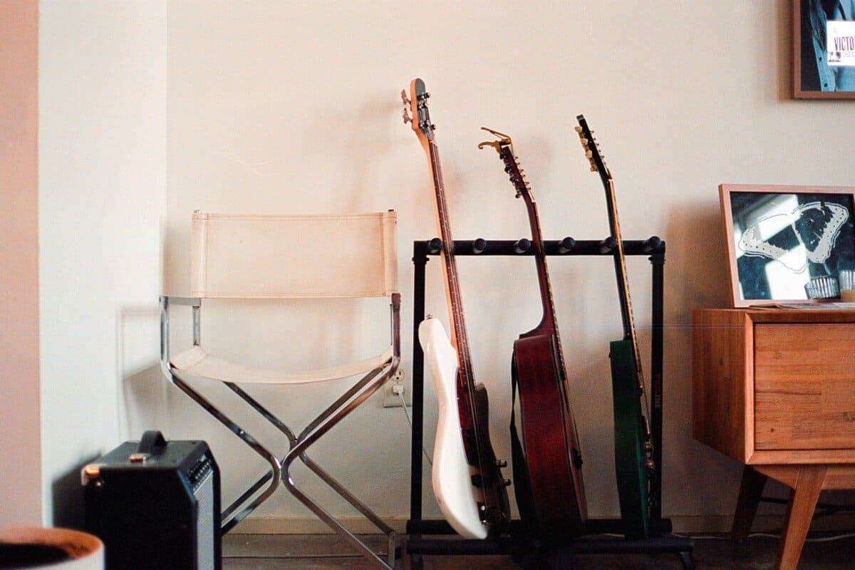 A directors chair and three guitar rack